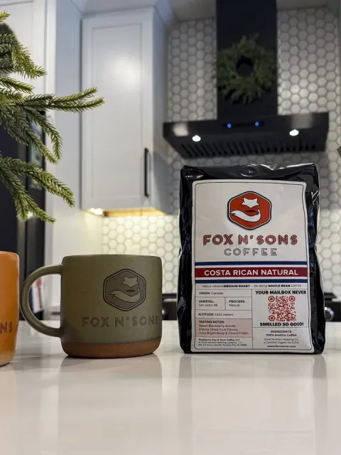 Fox N' Sons Coffee — a bag of Costa Rican Natural whole bean beside a branded stoneware mug